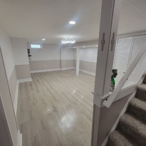 Basement remodel showing bright open layout and upgraded flooring by Homes by Covenant in Central New York