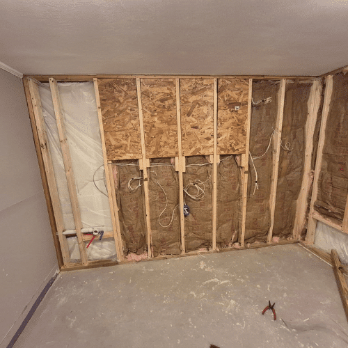 Interior basement framing during remodel project managed by Homes by Covenant