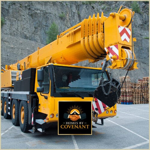 “Crane lifting modular home section into place during crane day setup.”