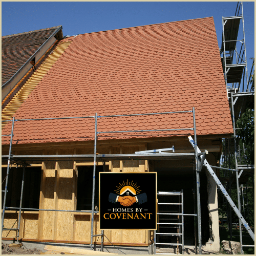 Home addition with roof extension and exterior framing under construction.