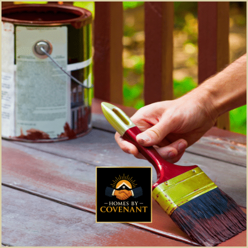 Stain and brush prepared for deck repainting.
